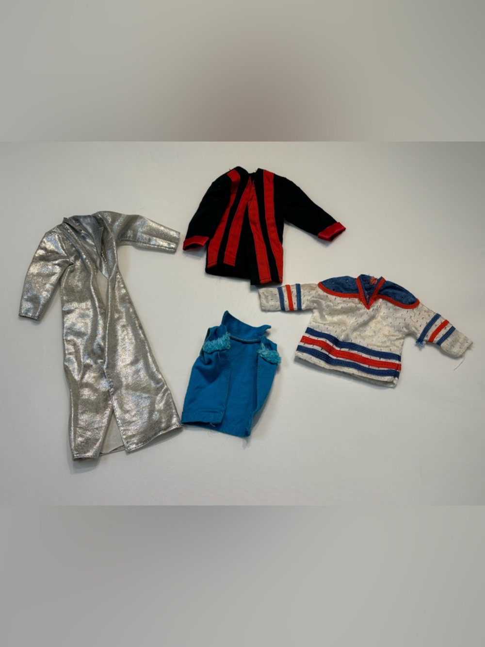 collection of vintage doll clothing features iconic pieces